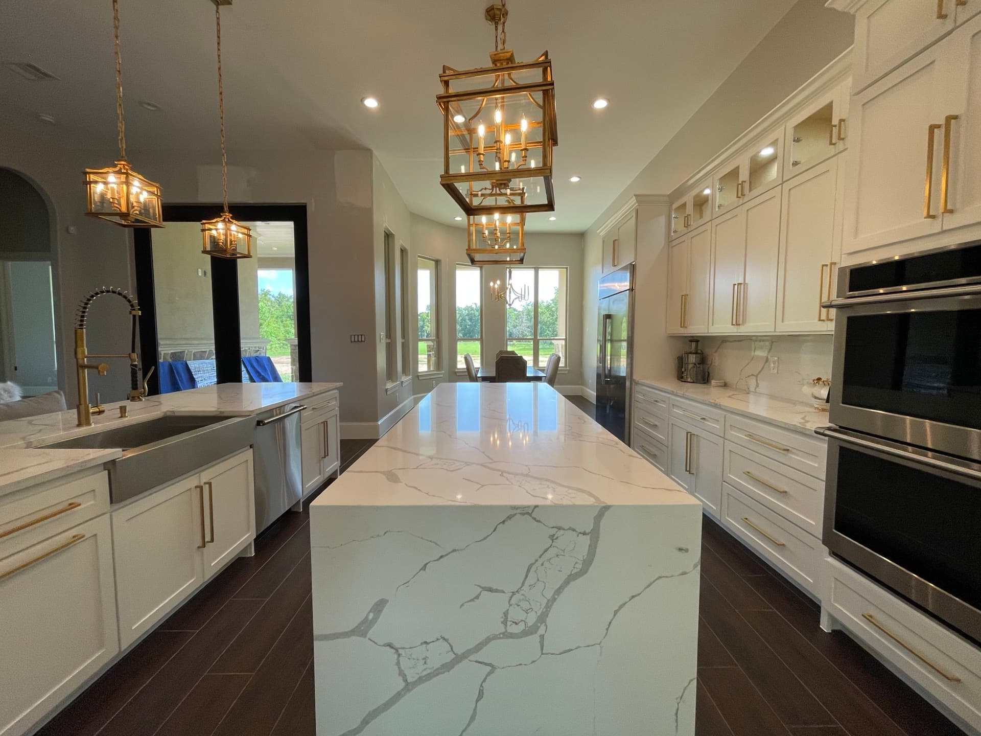 Finished custom kitchen by Crafted Kitchens with a large quartz island